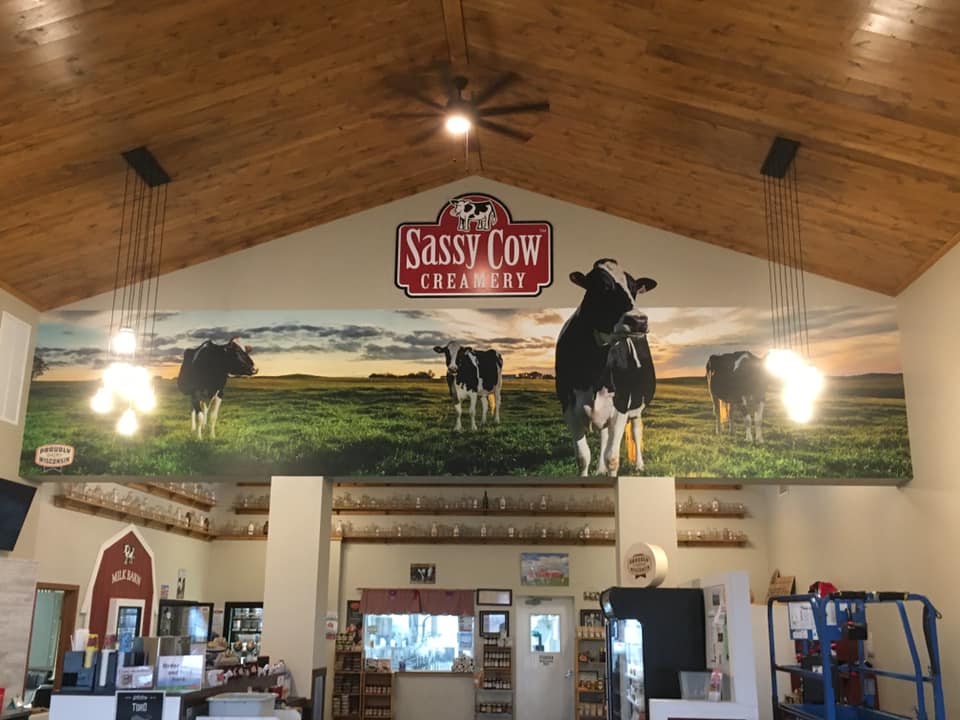 Cow Graphics banner on wall